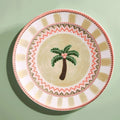 A Tale in Beads hand-painted dinner plate with beaded palm tree on sage green