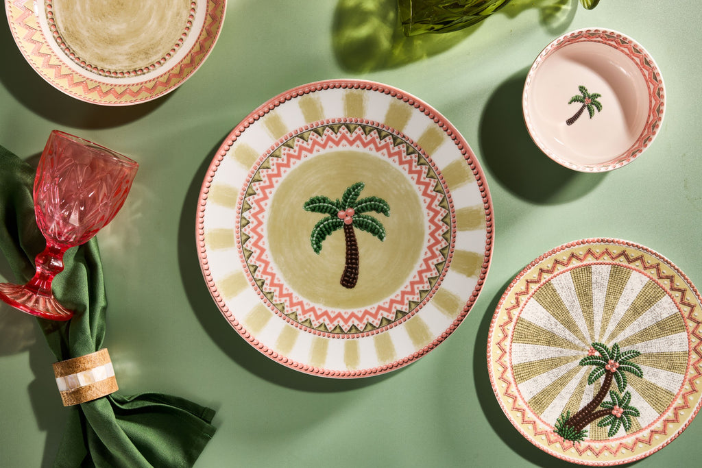 A Tale in Beads place setting flat lay with dinner plate, soup bowl and salad plate on sage green