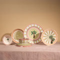 The full A Tale in Beads collection standing on pink linen