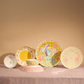 The full Pretty Past collection standing on pink linen