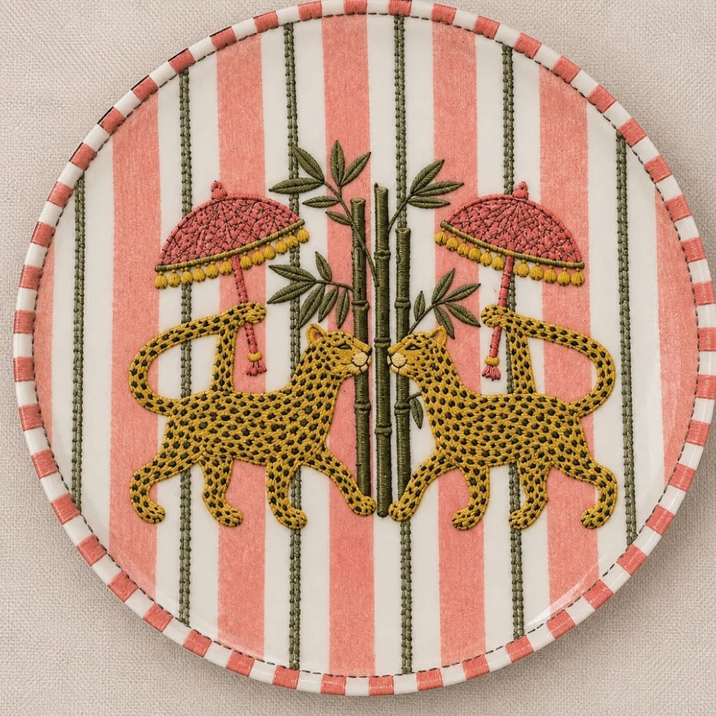 Stitches of the Wild dinner plate with hand-drawn leopards, bamboo and pink parasols
